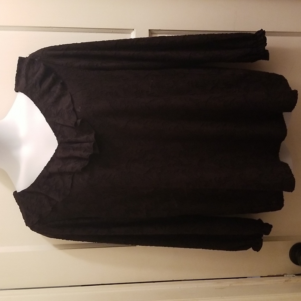 Black lace top with ruffle lace at neckline.